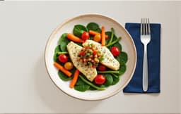 Poisson au four avec légumes, épinards et tomates cerises avec salade de pois chiches