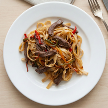 Fettuccine con ternera y pimientos asados