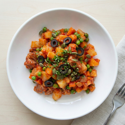 Latin pork stew with vegetables and pumpkin seeds