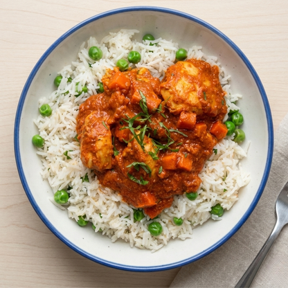 Light butter chicken with basmati pilaf and peas