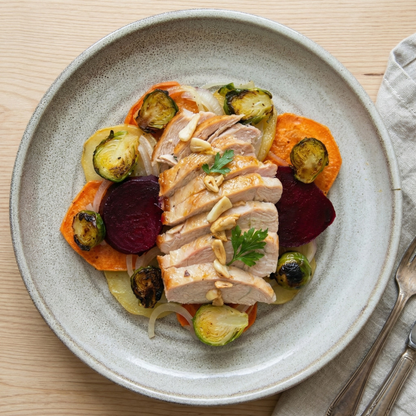 Pork loin with dates and vegetables, with roasted potatoes